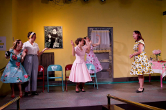 FIVE LESBIANS EATING A QUICHE